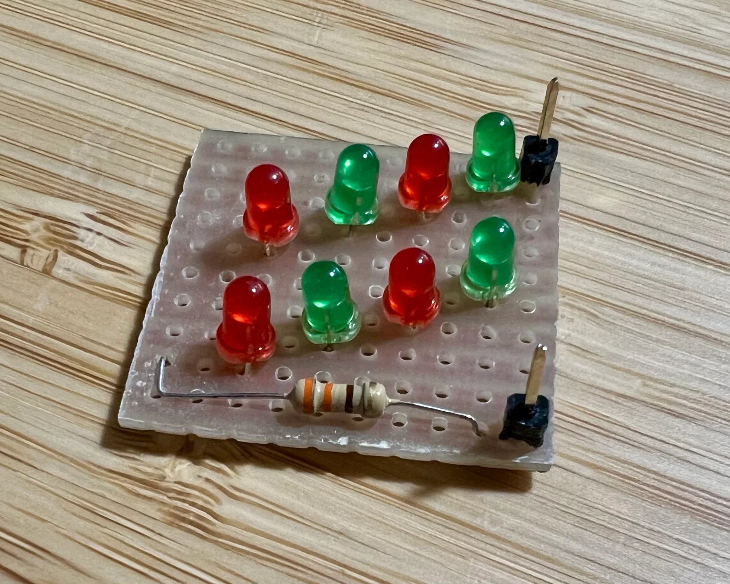 8 LEDs, one resistor, and two pins making up a 19v test load.