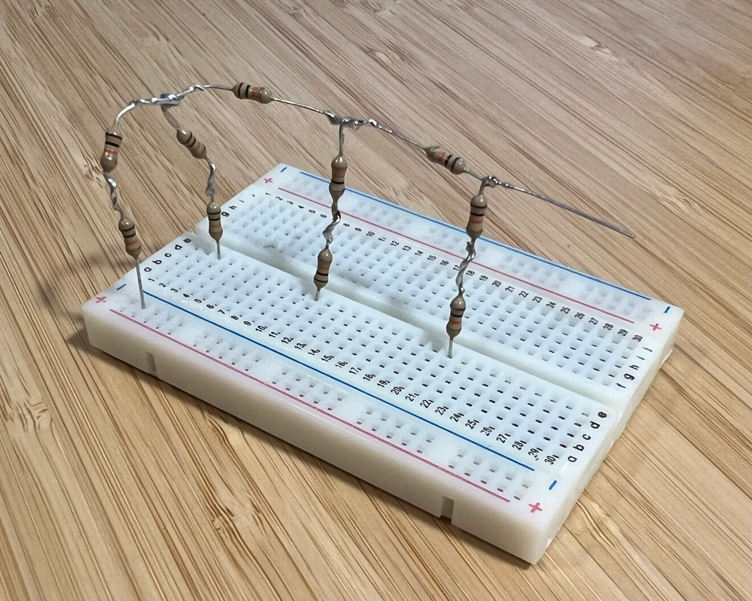10 resistors soldered in to a 3-bit R-2R Ladder DAC arrangement.