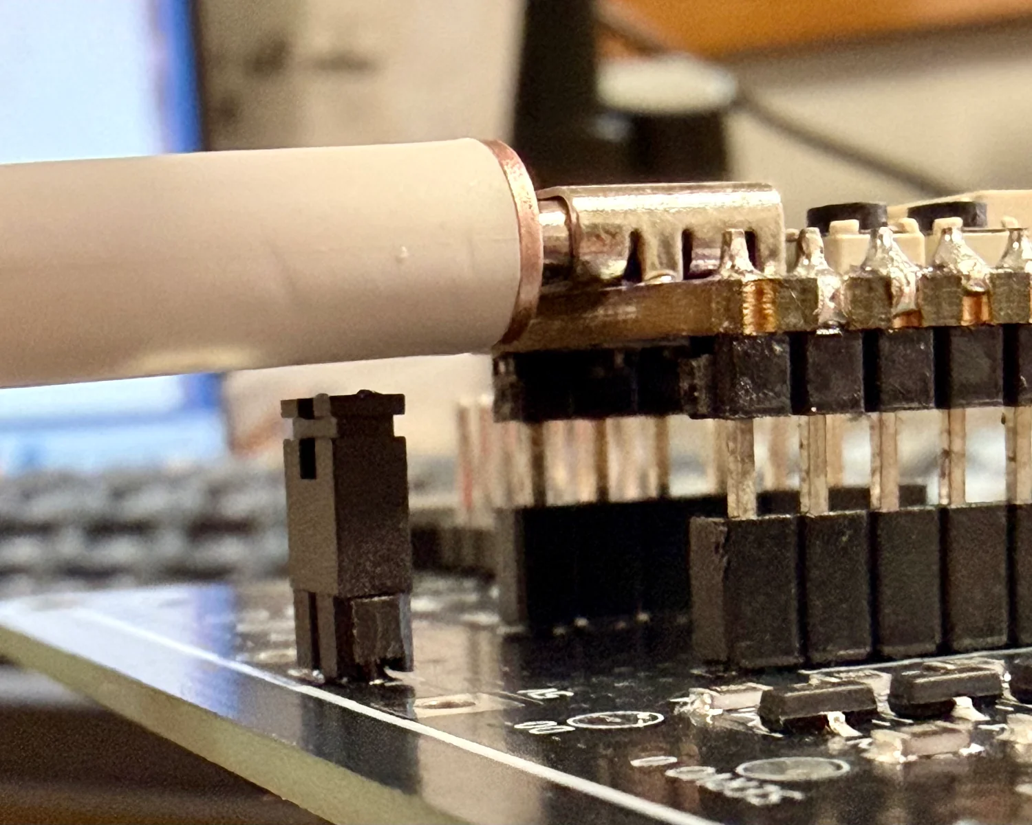 A USB-C cable connected to a QT Py, with plenty of clearance over the current measurement header.
