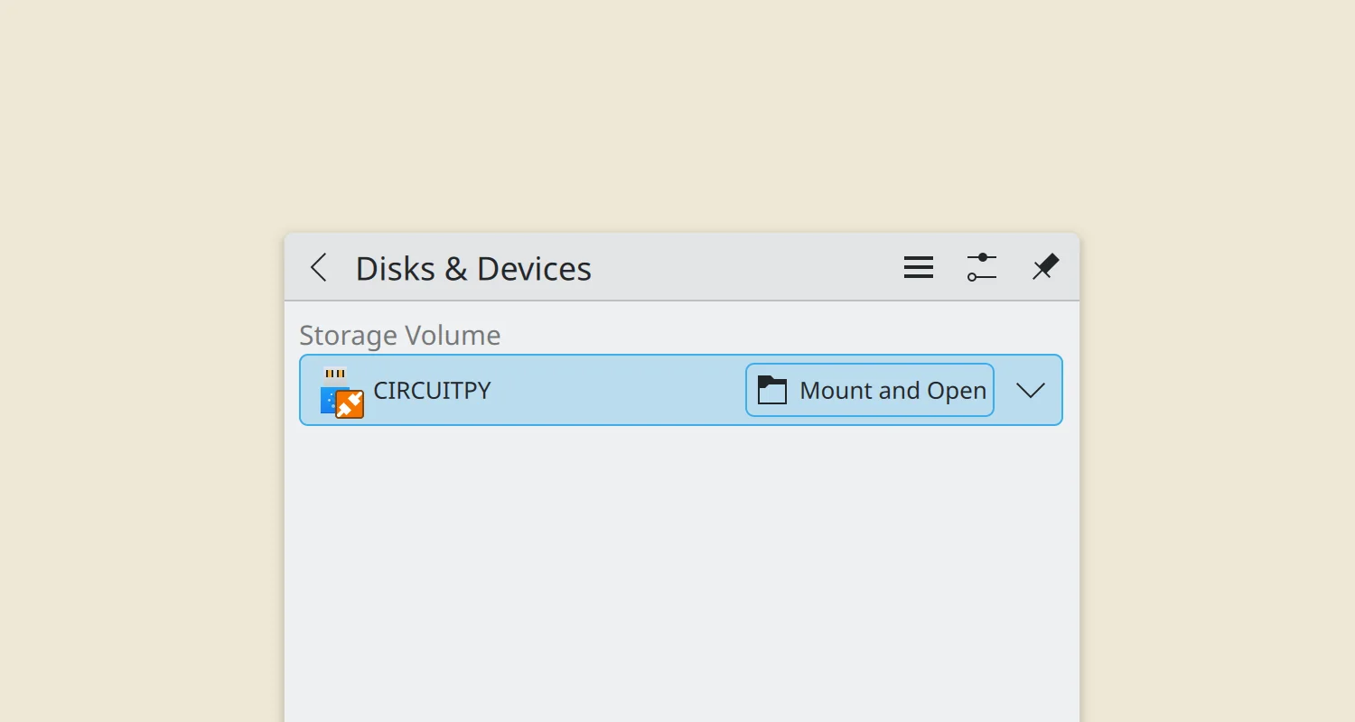 A screenshot of KDE offering to mount the CircuitPython USB device.