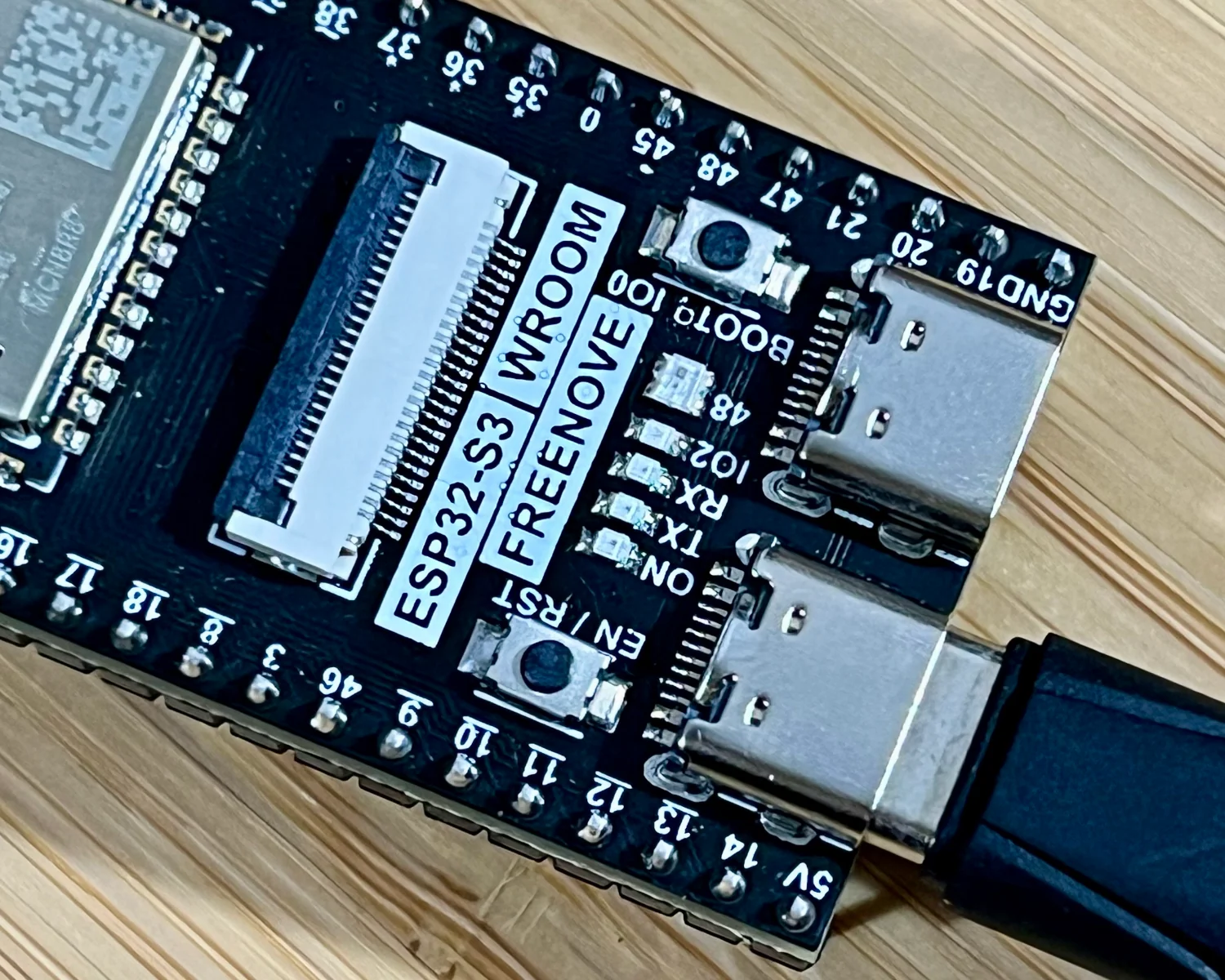 The Reset and Boot buttons on a Freenove ESP32-S3-WROOM CAM Board.