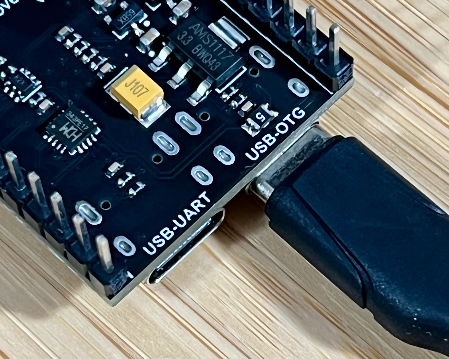 A USB-C cable connected to the USB-OTG port on a Freenove ESP32-S3-WROOM CAM Board.
