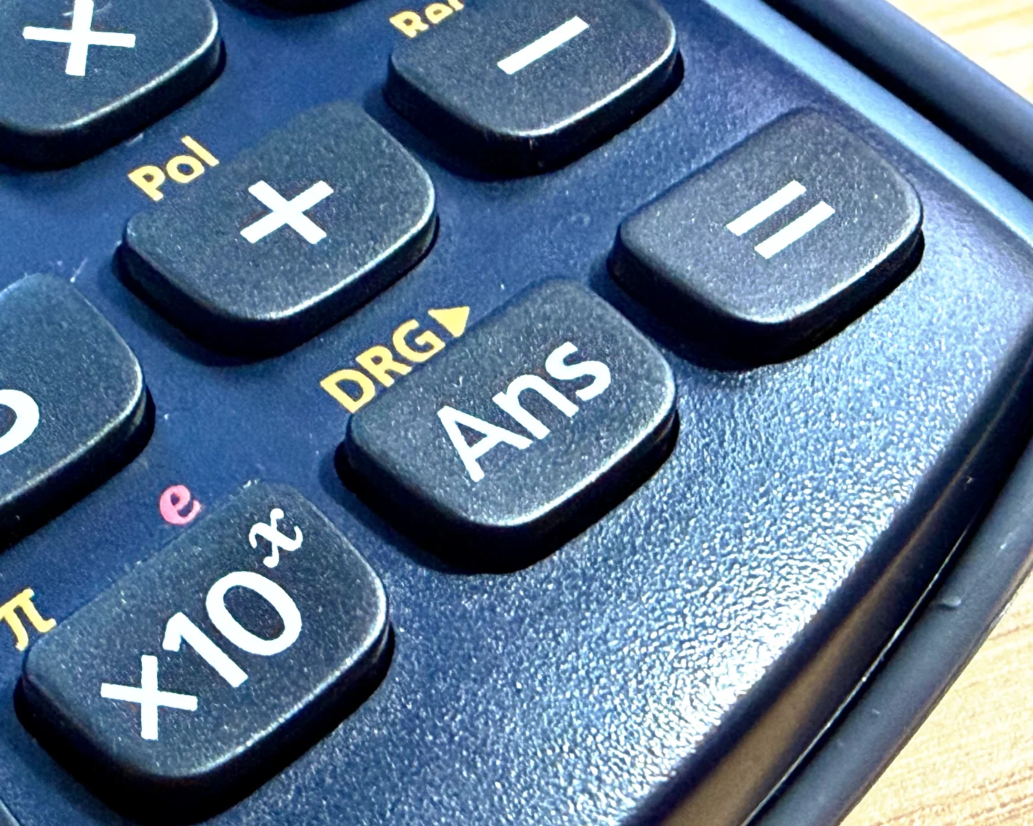 A close up of the Ans button on a Casio calculator.