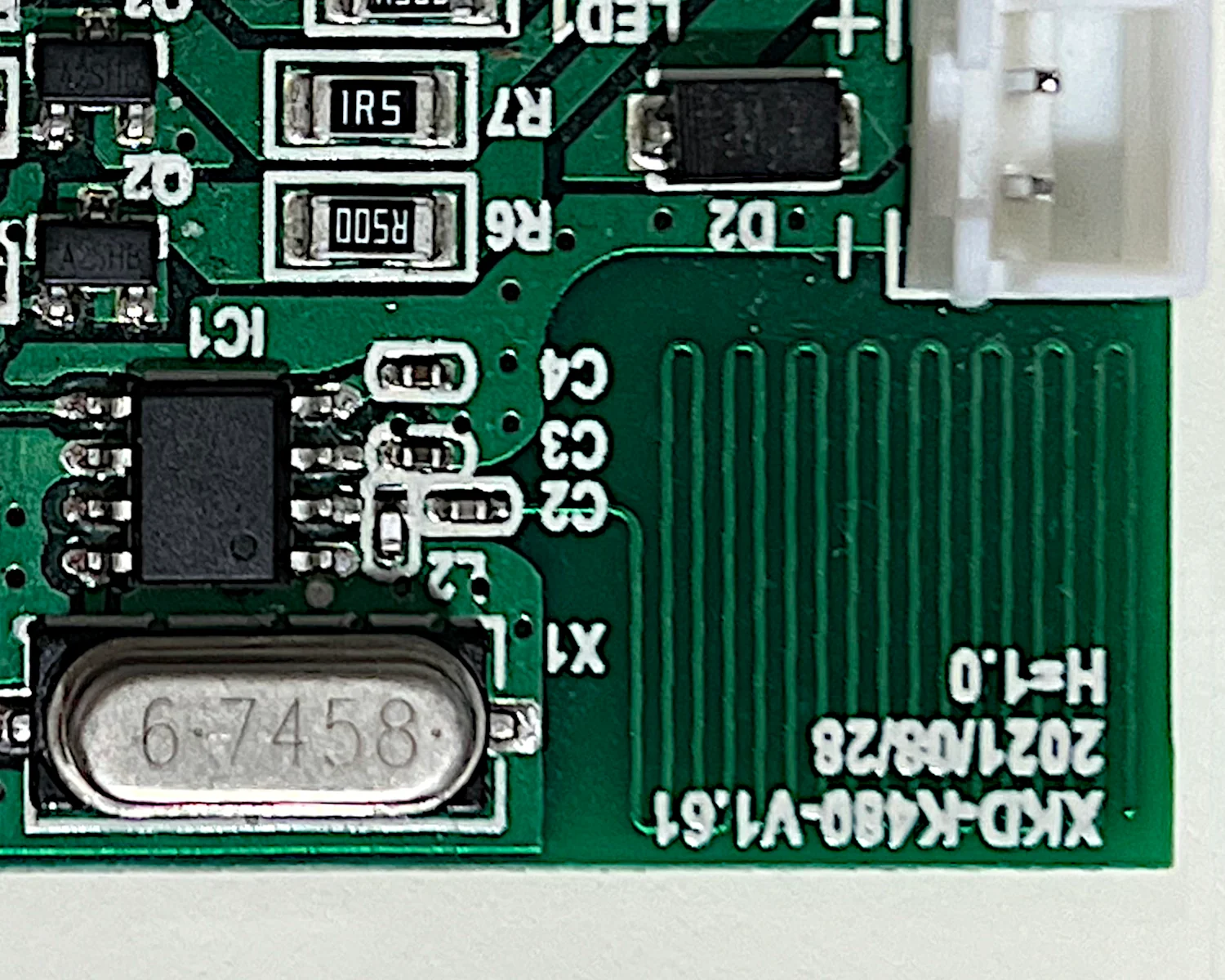 The PCB trace antenna and crystal on the night light's PCB.