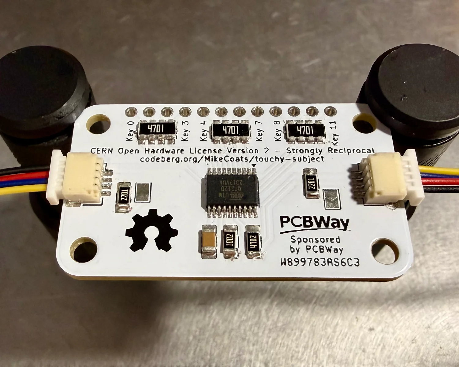 A Touchy Subject mounted in a test jig with the components visible.