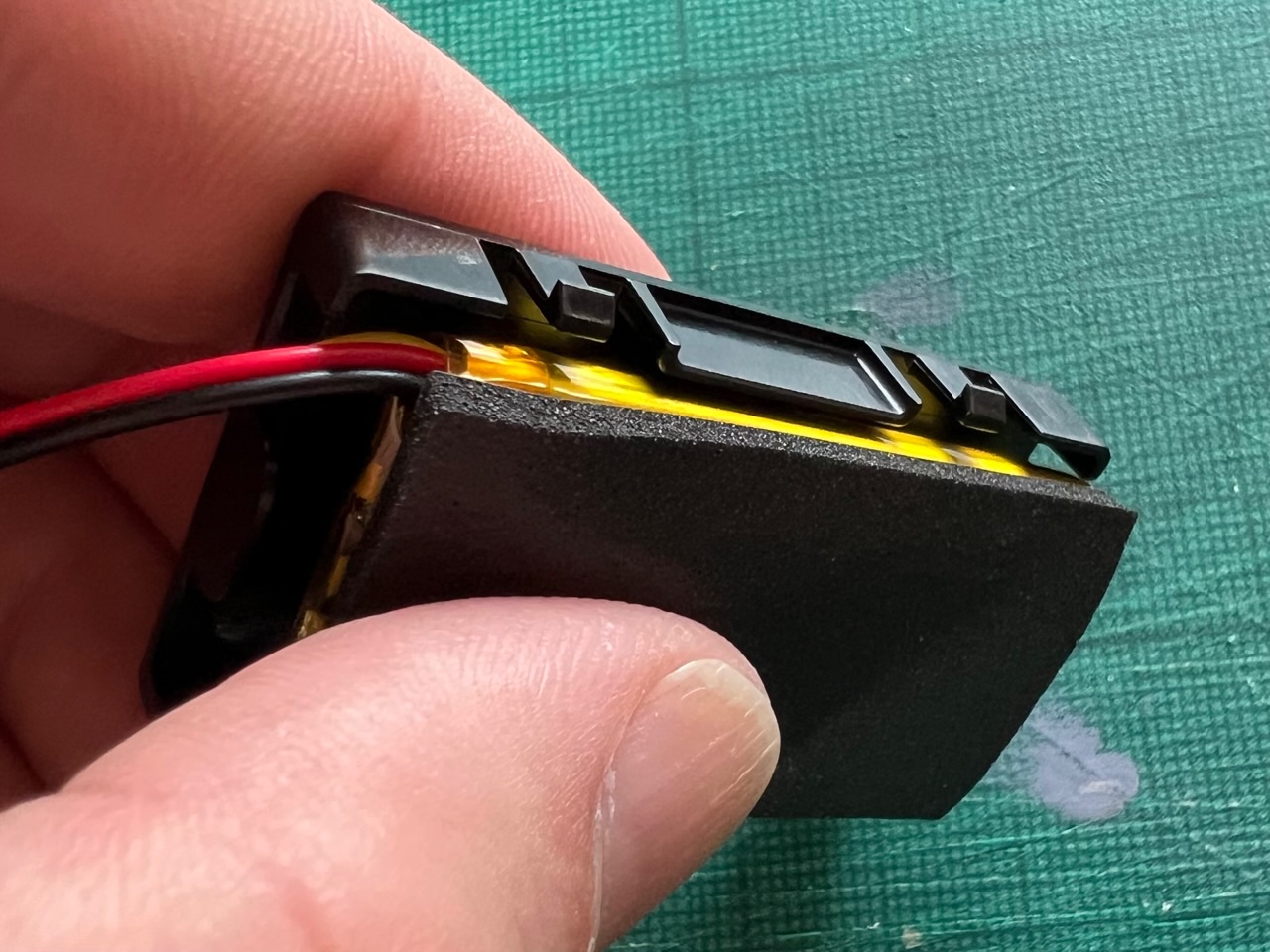 The internal battery of a VanMoof X3 Smart Cartridge removed for inspection.