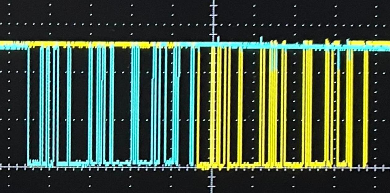 Two traces on an oscilloscope. One looks to be a question, the other looks to be the correlated response.